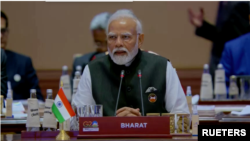 In this image taken from video, the placard in front of Prime Minister Narendra Modi at the G20 summit in New Dehli on Sept. 9, 2023, reads “Bharat” instead of “India."