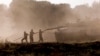 Israeli soldiers clean a tank gun barrel after returning from the Gaza Strip, amid the ongoing conflict between Israel and Hamas, near the Israel-Gaza border, in Israel, June 5, 2024.