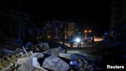 Rescuers work at the site where a building was destroyed during a Russian missile strike, amid Russia's attack on Ukraine, in Pokrovsk, Donetsk region, Ukraine, Aug. 8, 2023.