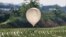 FILE - A balloon believed to have been sent by North Korea, carrying various objects including what appeared to be trash and excrement, is seen after landing in a rice field in Cheorwon, South Korea, May 29, 2024. (Yonhap via Reuters) 