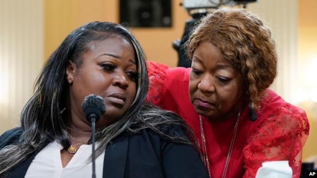 FILE - Wandrea 'Shaye' Moss, a former Georgia election worker, and her mother, Ruby Freeman, right, in Washington, June 21, 2022.