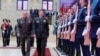 Menteri Pertahanan Rusia Sergei Shoigu (kiri) dan Menteri Pertahanan China Jenderal Li Shangfu menghadiri sebuah acara di Moskow, pada 18 April 2023. (Foto: Russian Defense Ministry Press Service photo via AP)