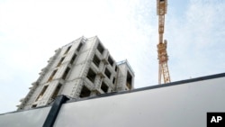 The logo for Country Garden developer is seen near the Country Garden One World City project under construction on the outskirts of Beijing.