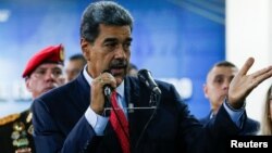 FILE - Venezuela's President Nicolas Maduro speaks at the Supreme Court of Justice in Caracas, Venezuela, July 31, 2024. U.S. officials announced Wednesday the arrest of a U.S. veteran who has claimed responsibility for an armed raid in 2020 that failed to remove Maduro.  