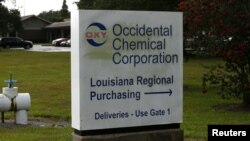 FILE - The entrance to an Occidental Chemical Corporation facility is pictured in Convent, La., June 11, 2018. Convent is located in the southeastern part of the state, part of a corridor surrounded by chemical plants.