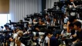 People of the media wait ahead of a press conference of Japan's talent agency Johnny & Associates chief Julie K. Fujishima in Tokyo, Sept. 7, 2023. 