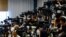 People of the media wait ahead of a press conference of Japan's talent agency Johnny & Associates chief Julie K. Fujishima in Tokyo, Sept. 7, 2023. 