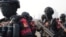 FILE - Counterterrorism police officers march during a show of force in Jakarta, Indonesia, Sept. 1, 2023.