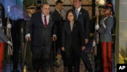 Taiwan's President Tsai Ing-wen and Guatemala's President Alejandro Giammattei arrive to deliver a joint statement at the National Palace in Guatemala City, March 31, 2023. 