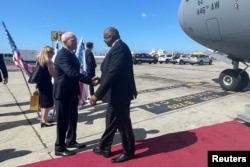 US Defense Secretary Lloyd Austin shakes hands with Israeli Defense Minister Yoav Gallant upon his arrival at Ben Gurion Airport, Israel, March 9, 2023.