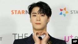 FILE - Moon Bin, a member of K-Pop group Astro, poses for photos at the 2021 Asia Artist Awards in Seoul, South Korea, Dec. 2, 2021. Moon Bin was found dead at his home in Seoul, his management agency said April 20, 2023. 