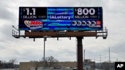 An electronic billboard advertises the Mega Millions and Powerball jackpots, March 25, 2024, in Des Moines, Iowa.