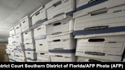 This undated image, released by the U.S. District Court Southern District of Florida, attached as evidence in the indictment against former U.S. President Donald Trump, shows boxes stored at Mar-a-Lago, the former presidents private club.