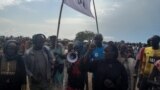 FILE- Internally Displaced Persons protesting against food ration cuts at a UN-run protection site in Bentiu, Sept. 06, 2023.