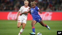 Haiti's Ruthny Mathurin kicks the ball ahead of Denmark's Pernille Harder during a Women's World Cup match in Perth, Australia, Aug. 1, 2023.