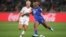 Haiti's Ruthny Mathurin kicks the ball ahead of Denmark's Pernille Harder during a Women's World Cup match in Perth, Australia, Aug. 1, 2023.