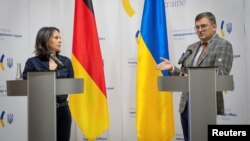German Foreign Minister Annalena Baerbock and Ukrainian Foreign Minister Dmytro Kuleba attend a joint press conference following their talks in Kyiv, Ukraine, Sept. 11, 2023.