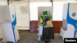 A person votes at a polling station during a special voting day, ahead of South Africa's general elections to elect a new National Assembly, in Cape Town, South Africa, May 27, 2024.
