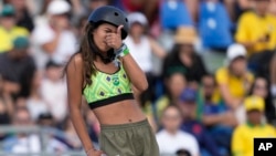 Rayssa Leal of Brazil gestures while waiting for her score during the women's skateboard street final at the 2024 Summer Olympics, July 28, 2024, in Paris, France.