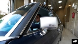 Khosro Dahaghin drives out his restored Cadillac Seville at his dealership store in Roudehen, some 30 miles (45 kilometers) east of downtown Tehran, Iran, June 7, 2023.