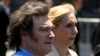 Javier Milei, left, and his sister, Karina, arrive at the government house in Buenos Aires, Dec. 10, 2023, after he was sworn in as Argentina's president.