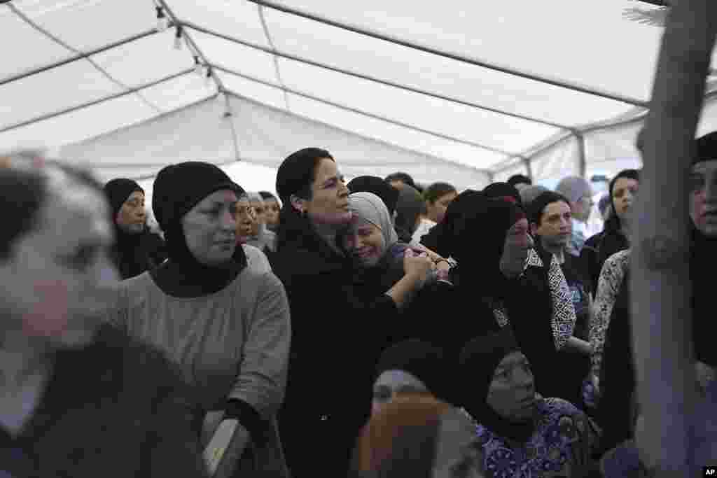 A woman weeps at the funeral for Abed al-Rahman Kashua, the director-general of the Municiprality in Tira, Israel.