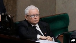 FILE - Jaroslaw Kaczynski, the leader of Poland's ruling party, listens during a parliament vote in Warsaw on Aug. 17, 2023. The Law and Justice party is seeking an unprecedented third term in the October 15 election.
