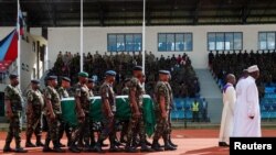 Members of Kenya Defence Force (KDF) escort the flag draped coffin of Kenya's military chief, General Francis Ogolla, on the day of a military honors and memorial service at the Ulinzi Sports Complex in Langata district of Nairobi, Kenya April 20, 2024.