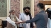 China’s new ambassador to Afghanistan, Zhao Xing, presents his credentials to Taliban Prime Minister Mohammad Hassan Akhund in Kabul on Sept. 13, 2023. (Taliban information ministry via VOA)