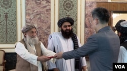 China’s new ambassador to Afghanistan, Zhao Xing, presents his credentials to Taliban Prime Minister Mohammad Hassan Akhund in Kabul on Sept. 13, 2023. (Taliban information ministry via VOA)