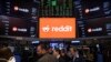 Reddit Inc. signage is seen on the New York Stock Exchange trading floor, prior to Reddit IPO, March. 21, 2024.
