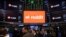 Reddit Inc. signage is seen on the New York Stock Exchange trading floor, prior to Reddit IPO, March. 21, 2024.