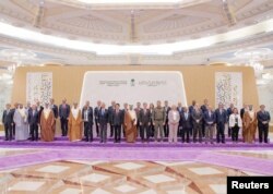 Representatives from more than 40 countries, including the U.S. and China, pose for a group photo as they attend talks in Jeddah, Saudi Arabia, Aug. 6, 2023, to find ways to end Russia's war in Ukraine. (Saudi Press Agency/Handout via Reuters)