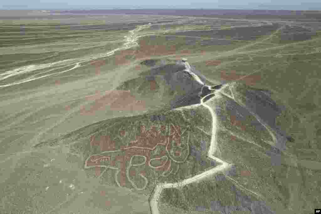 A cat-like Nazca Line geoglyph is seen from above in Nazca, Peru, May 17, 2023.