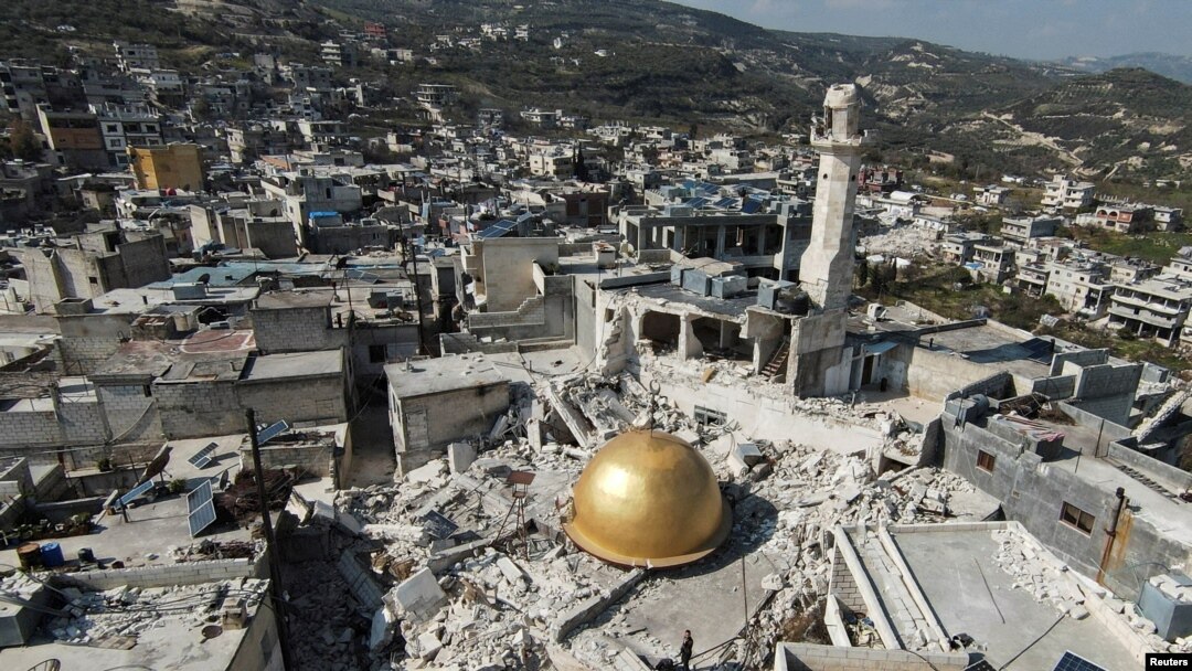 FILE - The remains of a mosque in the aftermath of a deadly earthquake in Idlib province, Syria, Feb. 24, 2023. Sources say Iran has used earthquake relief flights to bring weapons and military equipment into its strategic ally Syria.