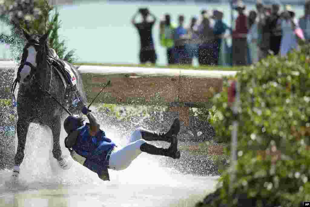 Ecuador&#39;s Ronald Zabala G., riding, Forever Young Wundermaske, fall off their horse during the Equestrian Cross Country competition at Chateau de Versailles for the 2024 Summer Olympics, in Versailles, France.