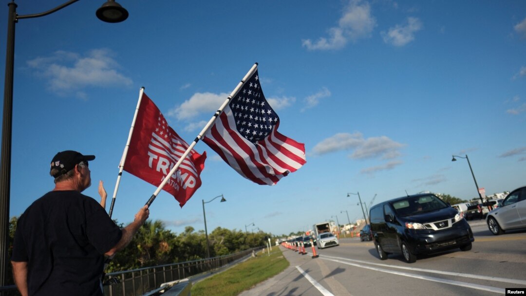 Supporters of former U.S. President Donald Trump gather outside his Mar-a-Lago resort, in Palm Beach, Florida, March 31, 2023.