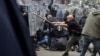 NATO Kosovo Force soldiers clash with local Kosovo Serb protesters at the entrance of the municipality office in the town of Zvecan, Kosovo, May 29, 2023. 