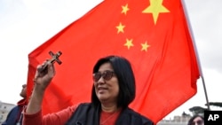 FILE - Chinese faithful attend the pope's weekly general audience in St. Peter's Square at the Vatican, May 22, 2019. 