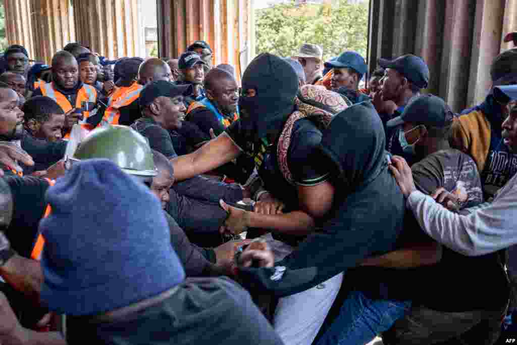 University security and demonstrating students clash as they attempt to gain entry to the Great Hall at the University of the Witwatersrand (WITS) in Johannesburg, South Africa.&nbsp;The students were protesting what they claim is a lack of adequate support from the university for unhoused students and those with outstanding fees.&nbsp;