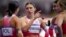 Krystsina Tsimanouskaya, of Poland, gestures as she talks with teammates following their women's 4x100-meter relay heat at the 2024 Summer Olympics, Aug. 8, 2024, in Saint-Denis, France.