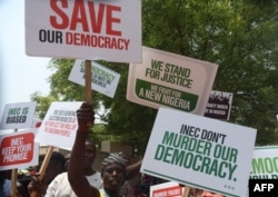 A group of people protest the outcome of the 2023 presidential election and the emergence of Bola Tinubu as the president-elect in Abuja, Nigeria on March 1, 2023.