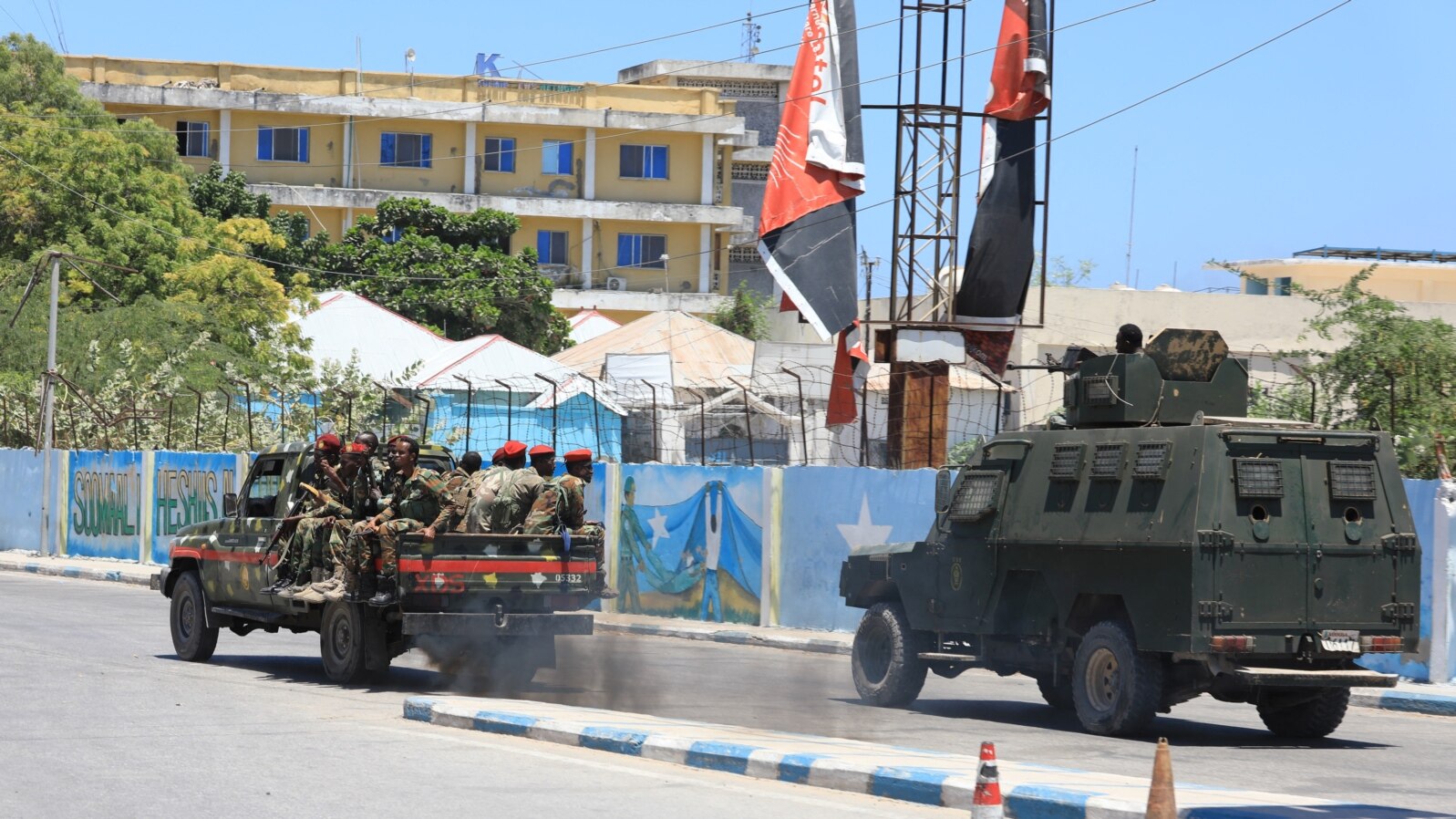 FILE - An armored personnel carrier (APC) drives in a street near a hotel in Mogadishu on March 15, 2024. Sporadic explosions and gunfire rang out from a popular hotel in the Somali capital early on that day.