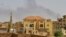 FILE - Smoke rises above buildings in Khartoum on May 12, 2023, as fighting between the forces of two rival generals continues. 