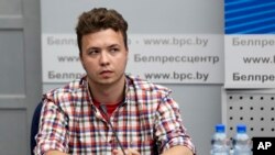 FILE - Belarusian dissident journalist Raman Pratasevich attends a news conference at the National Press Center of the Ministry of Foreign Affairs in Minsk, Belarus, June 14, 2021. He went on trial Feb. 16, 2023, facing charges including organizing mass unrest.