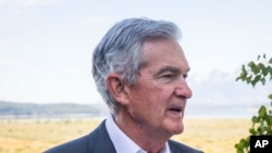 FILE - Federal Reserve Chairman Jerome Powell takes a break during the Jackson Hole Economic Symposium near Moran in Grand Teton National Park, Wyo., Aug. 25, 2023.