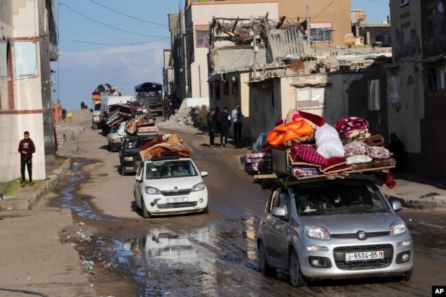 Palestinians flee the Israeli ground offensive in the central Gaza Strip, heading south through Deir al Balah, Jan. 5, 2024.