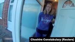 A view of Lucy Letby, who was convicted of killing five baby boys and two baby girls, being taken in custody by police, in Chester, Britain, in this screengrab from an undated handout video from the Cheshire Constabulary and obtained by Reuters on Aug. 17, 2023.