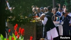 Indian Prime Minister Narendra Modi pays respects at a monument to Mahatma Gandhi in Kyiv, Ukraine, Aug. 23, 2024.