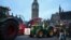 Farmers drive tractors around Parliament Square during a demonstration organized by Save British Farming against UK food policy, substandard imports and food labeling regulations, in London, March 25, 2024.